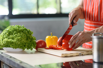 Guy preparing healthy food in kitchen