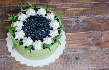 summer fruit cake rolled in  a pistachio  biscuit with billberry