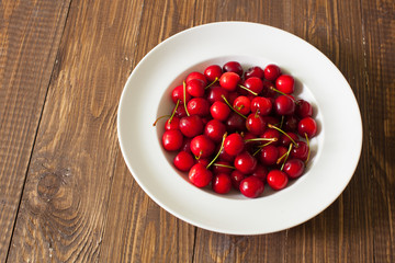 Fresh cherries in the white plate