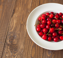 Fresh cherries in the white plate