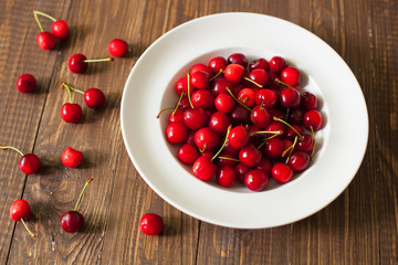 Fresh cherries in the white plate