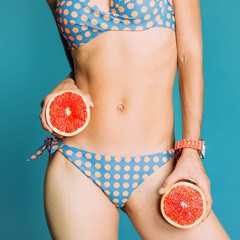 Girl with grapefruit. Citrus Energy Party fashion style