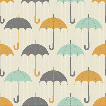 Seamless texture. Autumn. Depicts the umbrellas of the same size .Umbrella in three colors : grey, yellow and blue .Umbrellas in the rain. Umbrellas on a beige background.