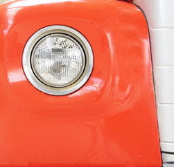 Color detail on the headlight of a vintage car