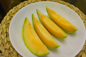 Fototapeta na wymiar Big harvest of melon in home garden