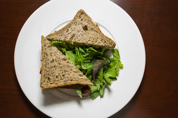 Fototapeta na wymiar Vegetarian sandwich served with a side salad