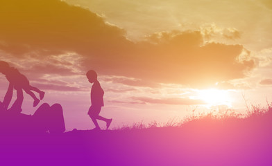 Fototapeta premium Happy family dancing on the road in the sunset time. Evening par