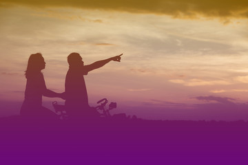 Silhouette of father use hand point his son look at meteor showe