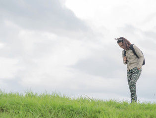 Carefree woman having a good time at the meadow