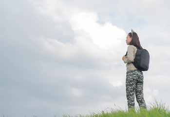 Carefree woman having a good time at the meadow