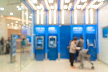 Abstract blur people using atm