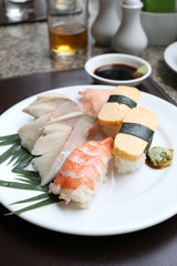 Seafoods Sushi on white dish in the restaurant.
