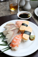 Seafoods Sushi on white dish in the restaurant.