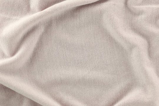 Closeup of rippled Cream color cotton fabric.