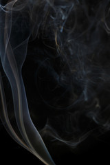 Abstract blue smoke from aromatic sticks.