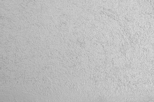 Gray stucco cement wall Background texture empty.