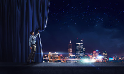 Night city behind curtain