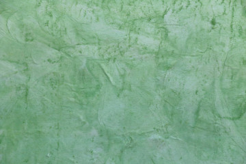 Concrete surface painted green color.
