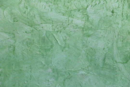 Concrete surface painted green color. © meepoohyaphoto