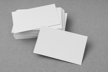 Business cards on gray background .