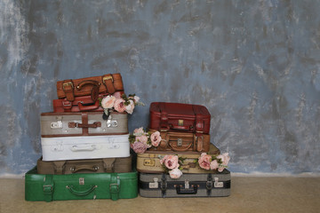 Many vintage suitcases with flowers