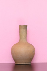 Brown Pottery Vase on wooden table.