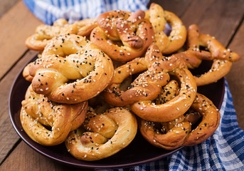 Oktoberfest salted soft pretzels in a plate from Germany on wooden background