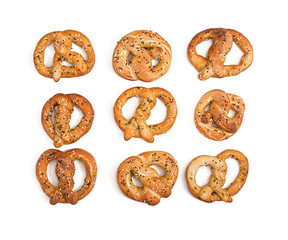 Pretzels with salt and sesame seeds isolated on white background. Top view. Oktoberfest.