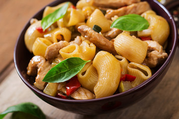Pasta Gomiti Rigati with meat and vegetables in an Asian style.
