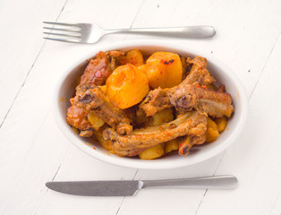 aerial make pork stew in white earthenware  on white