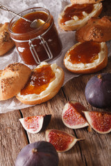 buns with fig jam and cream cheese close-up. vertical
