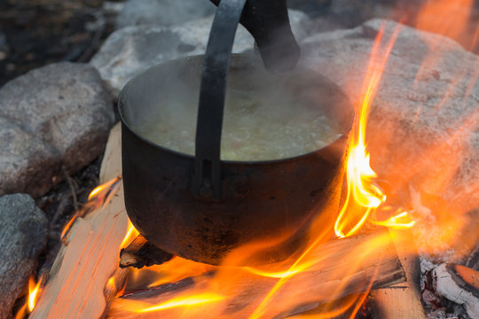 soup cooked in a pot on the fire