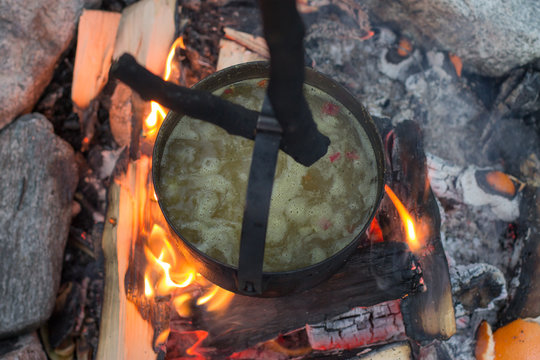 soup cooked in a pot on the fire