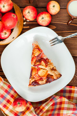 Apple pie on a wooden background