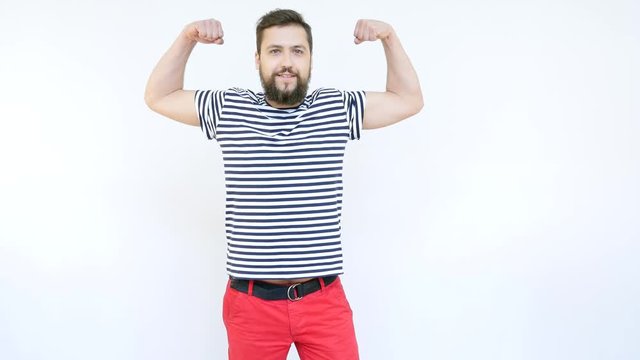 Handsome Seaman with a Beard Showing Muscles and Smiling