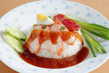 Rice. Barbecued red pork in sauce with rice