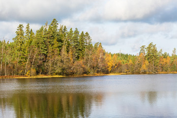 Lake in the forest with autumn colors in the forest