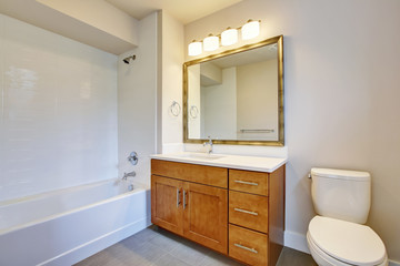 Bathroom interior in white tones and vanity cabinet.