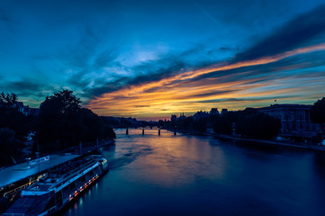 Beautiful lovely sunset over the Seine river in Paris, France