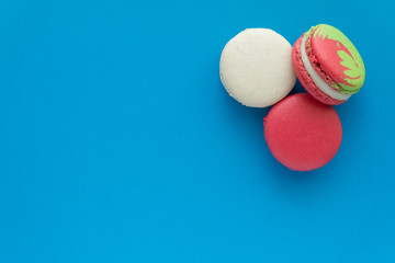 Colorful france macarons on blue background