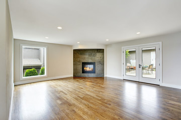 Fototapeta na wymiar Empty living room interior in light tones with fireplace.