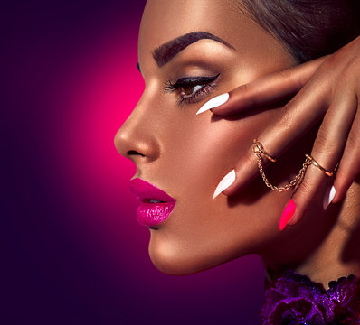 Fototapeta Sexy model with brown skin and purple lips over dark background