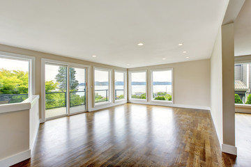 Empty living room interior in light tones with hardwood floor