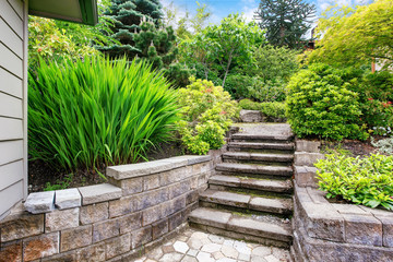 View of concrete stairs to garden at backyard.