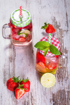 Summer strawberry lemonade in a jar glass