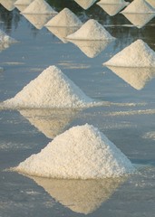 Heap of sea salt in a farm prepared for harvest at chanthaburi Thailand.