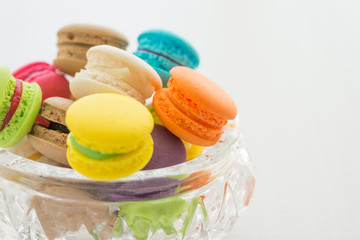 Colorful france macarons in glass cup.