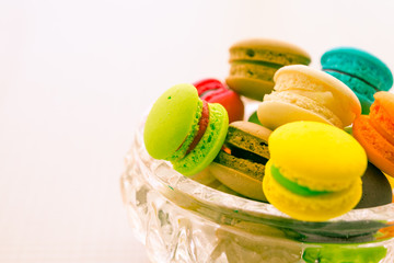 Colorful france macarons on glass cup.