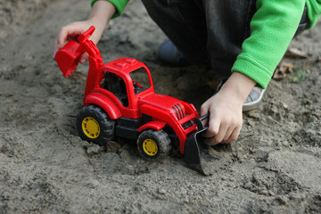 The boy with The car-excavator.