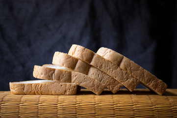 Bread wheat slice on dark background